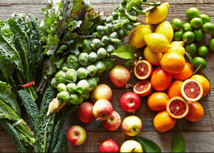 a group of fruits and vegetables on a wood surface Healthy Weight Loss Diets Beccles
